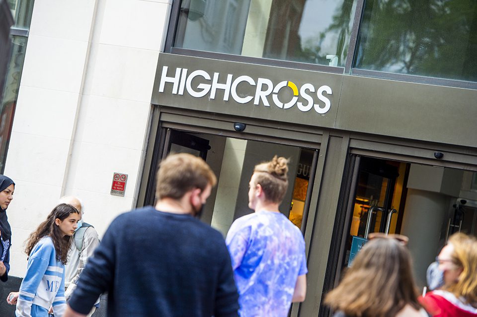 A crowd of people walk past the entrance to Highcross shopping centre in Leicester city centre